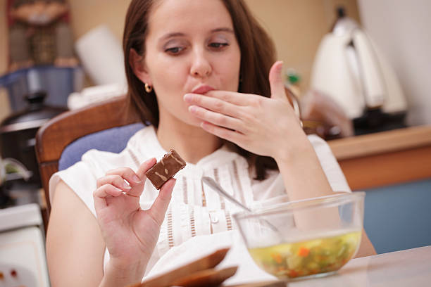 istock woman looking at chocolate 153902222