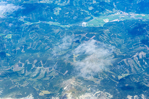 View to a land and clouds from airplane