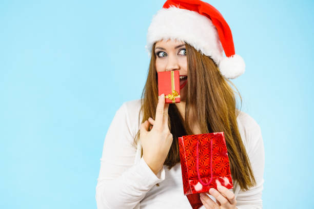 istock Happy Christmas woman holds red gift box 1539038593