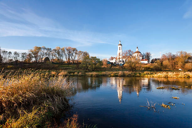 istock landscape with river and church 153904801