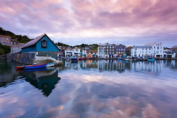 Reflections in Mevagissey harbour Cornwall England UK