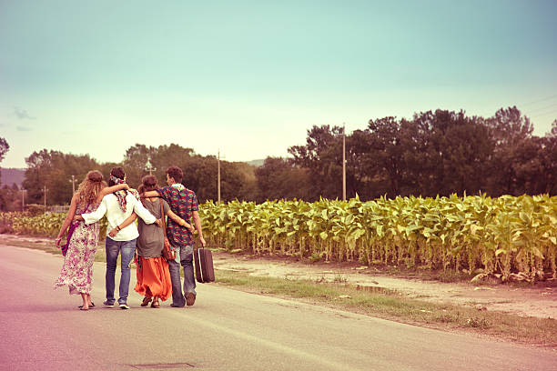 istock Hippie guys walking on the road 153905603