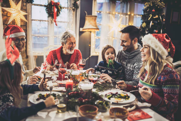 istock Happy extended family having New Year's lunch at dining table. 1539062340