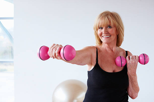 istock Senior Woman Training with Weights 153907903