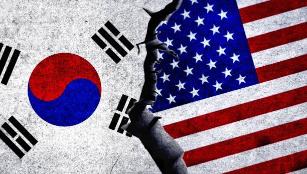 istock USA and South Korea flag together on a textured wall. 1539087201