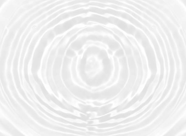 istock White water with ripples on the surface. Defocus blurred transparent white colored clear calm water surface texture with splashes and bubbles. Water waves with shining pattern texture background. 1539101277