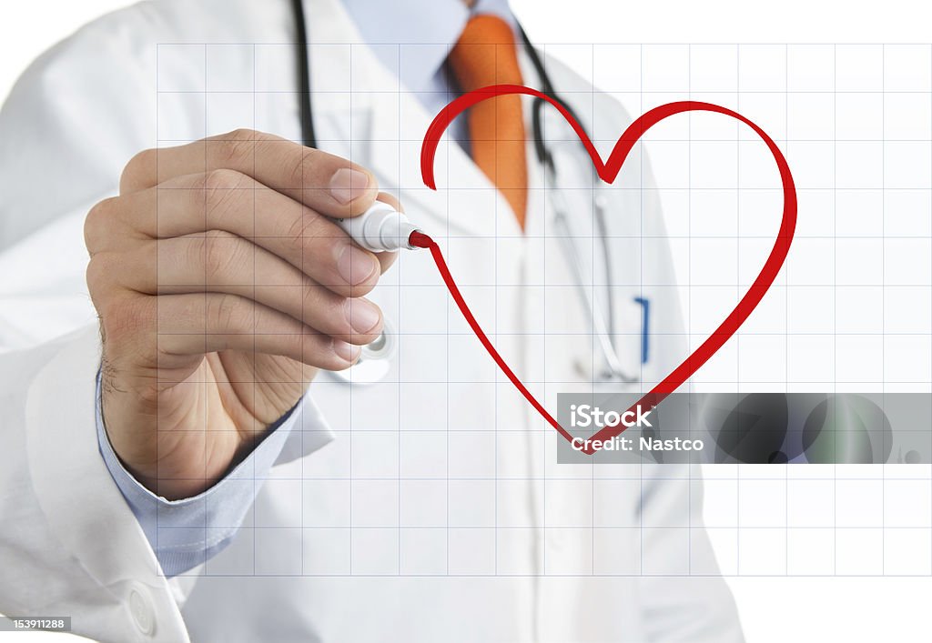 Doctor drawing heart symbol Male doctor drawing heart symbol at the interactive whiteboard Doctor Stock Photo