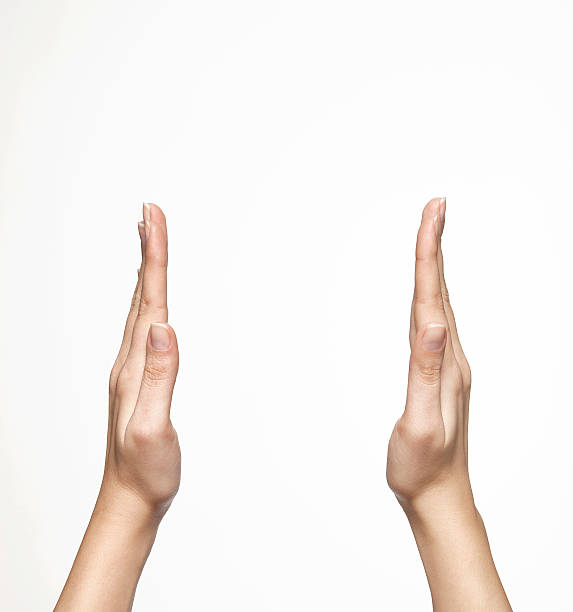 Two hands raised and spread apart as if about to clap stock photo