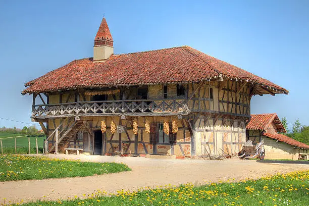 Image of a historic farm house in Bresse country (Ain department, Rhones-Alpes region of France) in spring using HDR technique. It is believed the farm was established at the end of the 16th century and was inhabited just until 1968. Today it is open as a musem (Ferme-Musee de la Foret, Courtes, France).