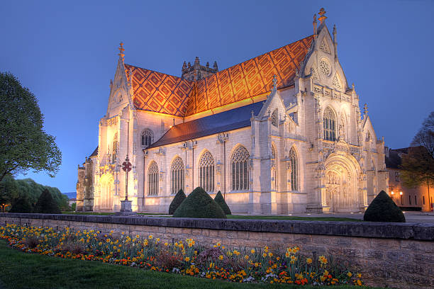 Royal Monastery of Brou, Bourg-en-Bresse, France Night view of the flamboyant gothic church of the Royal Monastery of Brou, at the outskirts of Bourg-en-Bresse city, Ain department, Rhone-Alpes region of France. The monastic compount was build at the begining of the 16th century by Margaret of Austria, dauther of Holy Roman Emperor Maximilian I. HDR image. ain france photos stock pictures, royalty-free photos & images