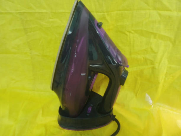 istock steam Iron on a yellow background. Ironing clothes on a yellow background. 1539137347