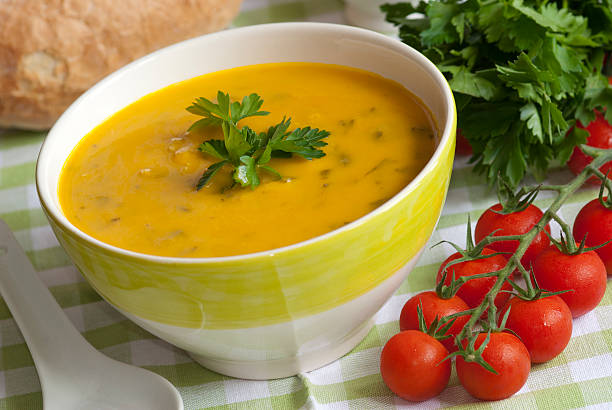 Fish soup in a yellow and white bowl Sweet potato, smoked haddock and spinach soup in a bowl Chowder stock pictures, royalty-free photos & images