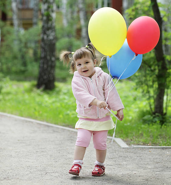 istock happy child with ballon 153914670