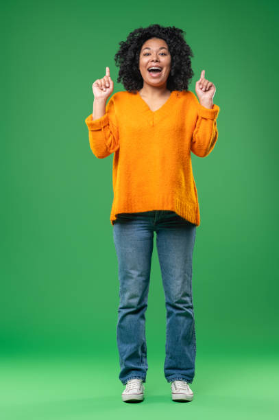 istock Young pretty curly-haired woman looking excited 1539182599