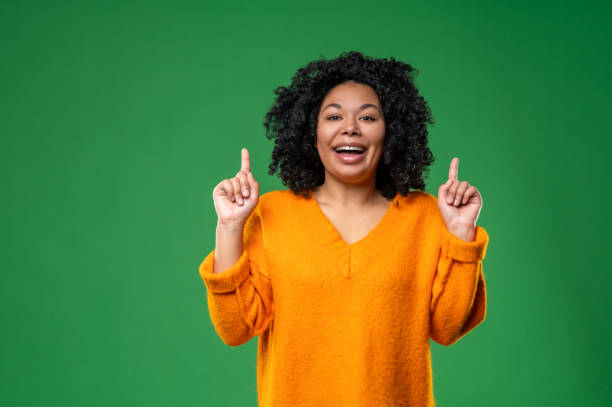 istock Young pretty curly-haired woman looking excited 1539182613