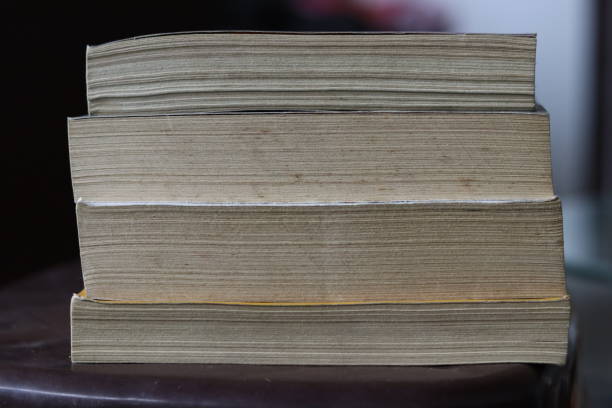 istock A Vertical Pile of old Dirty Books on a A stool 1539194255