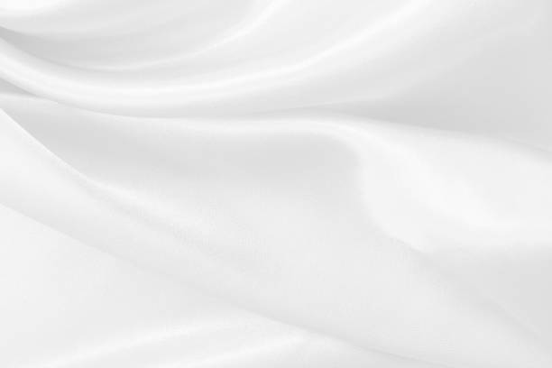 istock White fabric texture for background and design, beautiful pattern of silk or linen. 1539195332