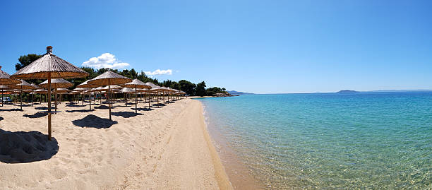 Panorama of a beach and turquoise water Panorama of a beach and turquoise water at the luxury hotel, Halkidiki, Greece halkidiki stock pictures, royalty-free photos & images