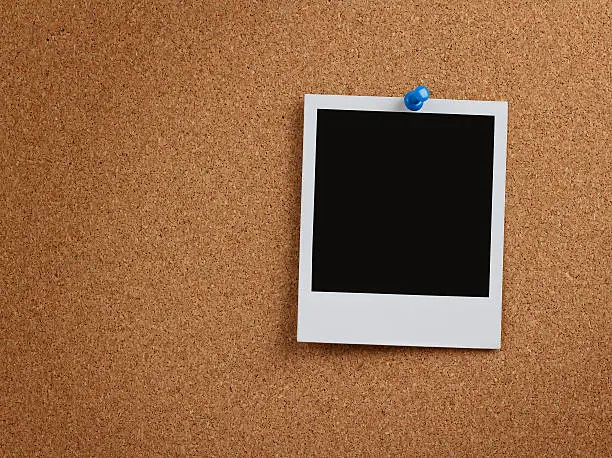 Photo of Blank instant photo at cork board