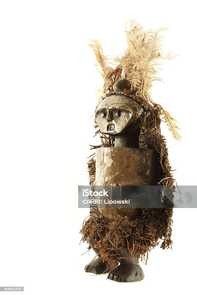 Woodoo doll Old african voodoo doll soiled with smoke isolated on white background African Culture Stock Photo