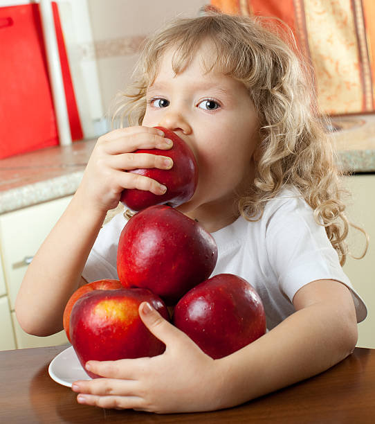istock Girl with apples 153923752