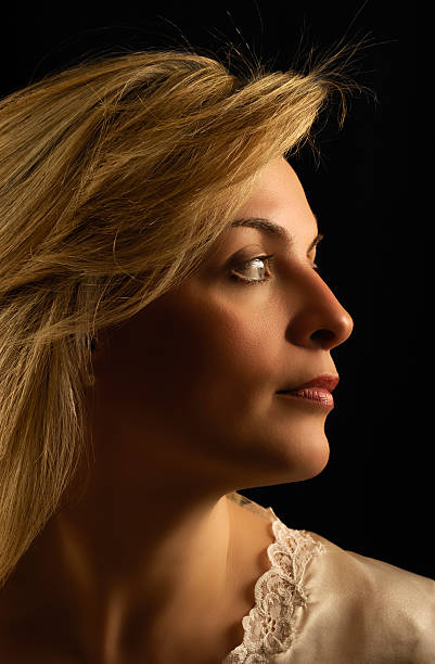 istock Beautiful young woman looking sideways 153923790