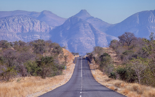 Road passing through bushveld near the foot of Abel Erasmus Pass in the Limpopo Province of South Africa.