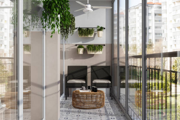istock Modern Enclosed Balcony With Wicker Chairs, Coffee Table And Creeper Plants 1539244077