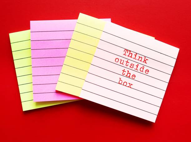 istock note pad on red background with text written THINK OUTSIDE THE BOX , concept of breaking status quo to find innovative solution or create something differently, stand out from the crowd 1539257690