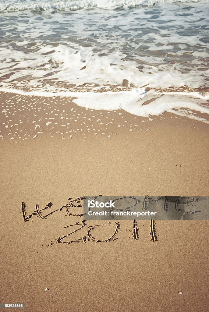 Benvenuto 2011 messaggio nella sabbia - Foto stock royalty-free di Acqua