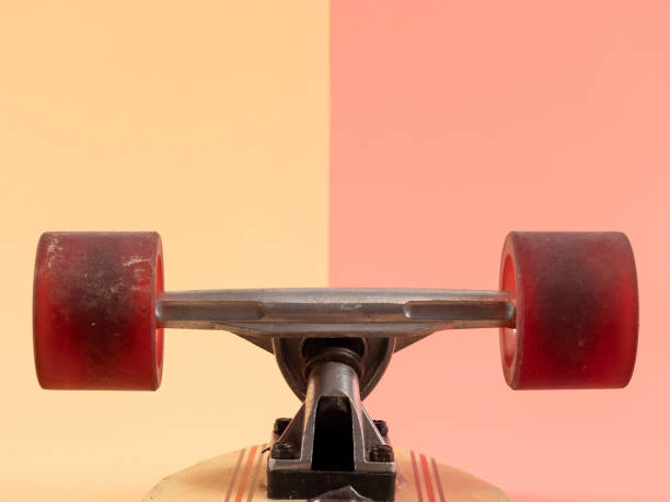 istock Skateboard on a pink and orange background. 1539328858