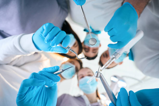 five dentists with special tools in their hands - caucasian cavity clinic color image imagens e fotografias de stock