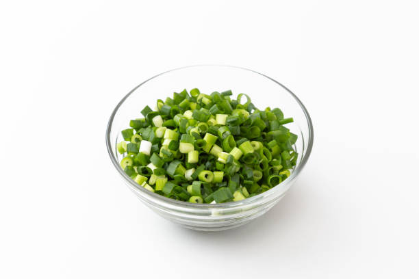 istock Chopped green onions on a white background. 1539340037