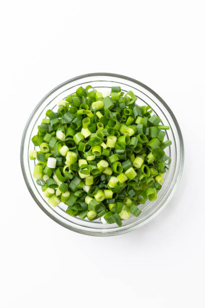 istock Chopped green onions on a white background. 1539340051