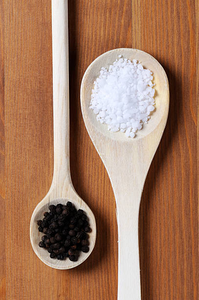 istock wooden spoons with salt and pepper 153935034