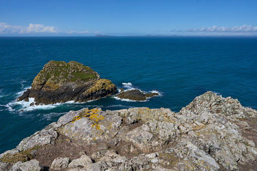 Rugged coastline of the Island of Skomer off the coast of Pembrokeshire in Wales, United Kingdom.
