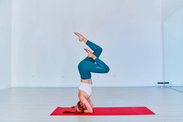 istock Young flexible woman practicing yoga exercise in studio class 1539417791