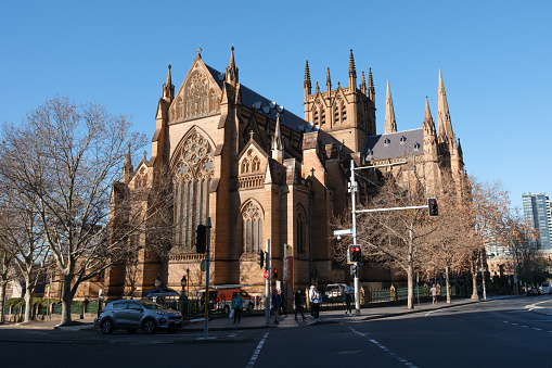 Sydney, Australia - July 12, 2023: St Mary's Cathedral, opposite Hyde Park on a sunny day. Built from 1866 to 1928, it is located in College Street near the Eastern border of Sydney's CBD.