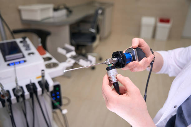 istock Doctor otolaryngologist at workplace with special tool in his hands 1539472462