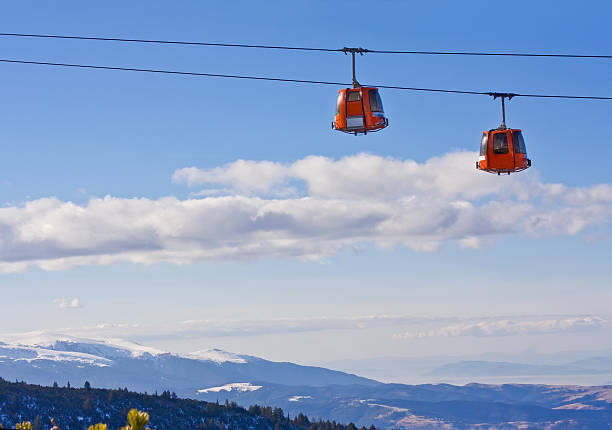istock Cable car ski lift over mountain landscape 153948886