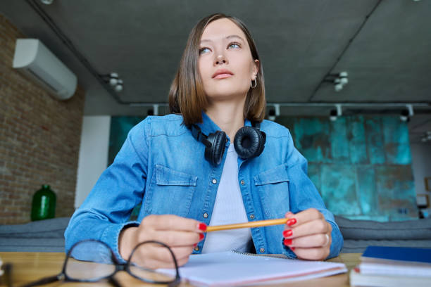 istock Close-up webcam view of face female university student 1539517911