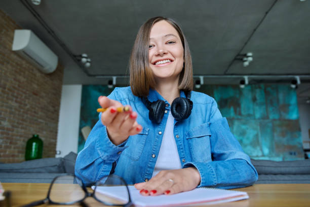 istock Close-up webcam view of face female university student 1539518941