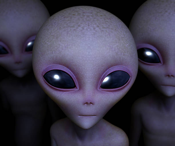 A digital image of three aliens staring at a bright light  stock photo