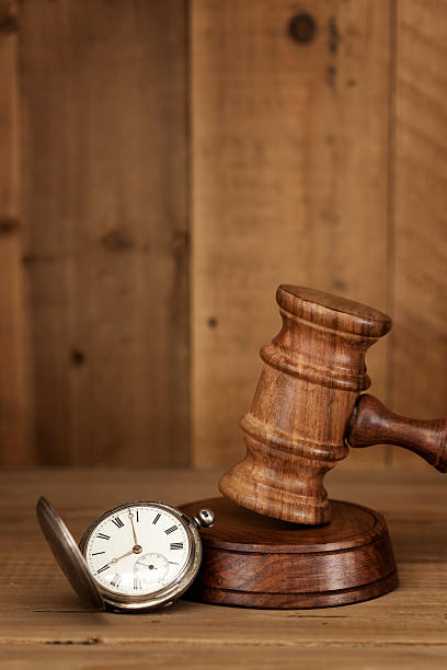 istock Gavel and Pocket Watch with Grunge Effects 153954098