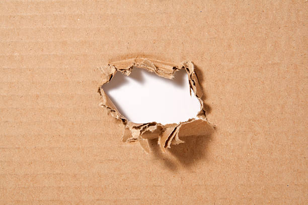 istock hole in the paper 153954278