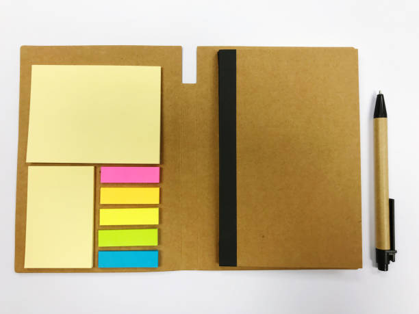 istock Blank note book with pen on white background, ready for your message 1539550885