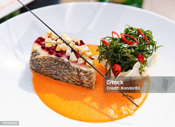 Seabass Haute Cuisine Dish With Herbs Stock Photo - Download Image Now - Appetizer, Brightly Lit, Cooked