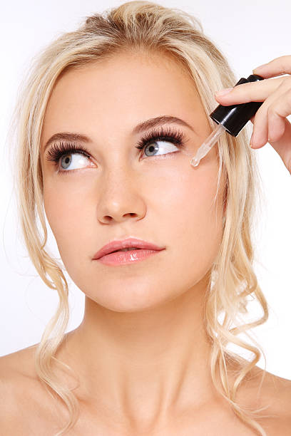 istock Woman applying serum 153956226