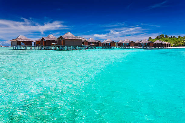 istock Overwater bungallows in blue lagoon 153957157