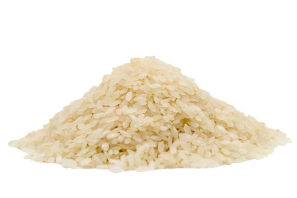 istock Raw rice isolated on white background. Uncooked dry rice. close up 1539581766